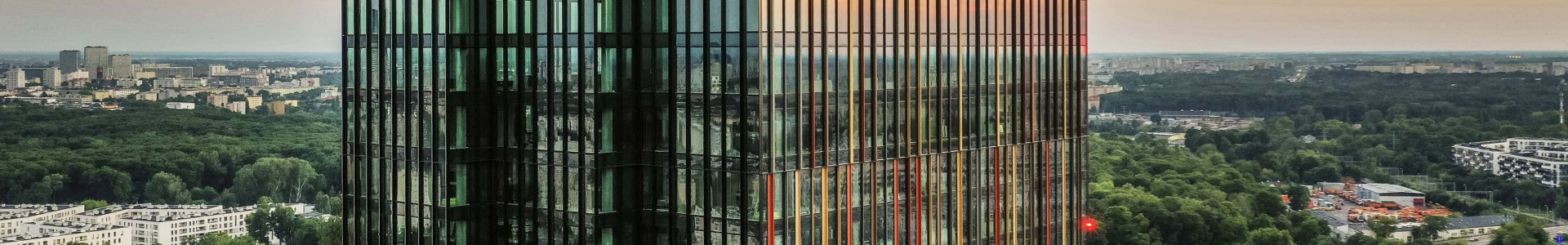 HB&nbsp;Reavis office building at dusk against the city skyline